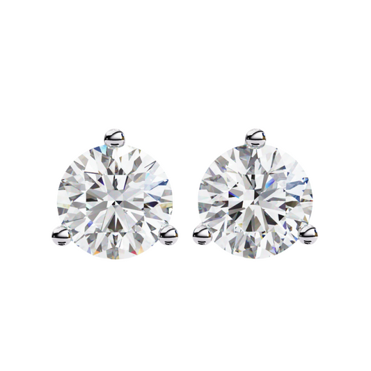 Pair of diamond stud earrings on a white background