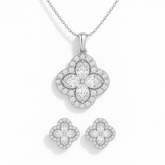 Floral silver jewelry set with necklace and earrings on a white background