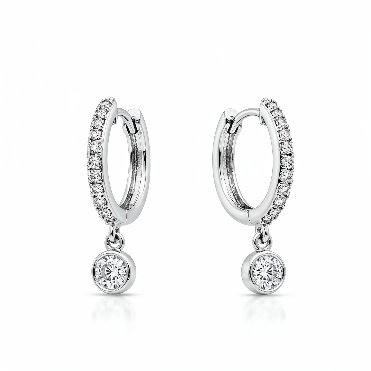 Pair of silver hoop earrings with small round gemstones on a white background