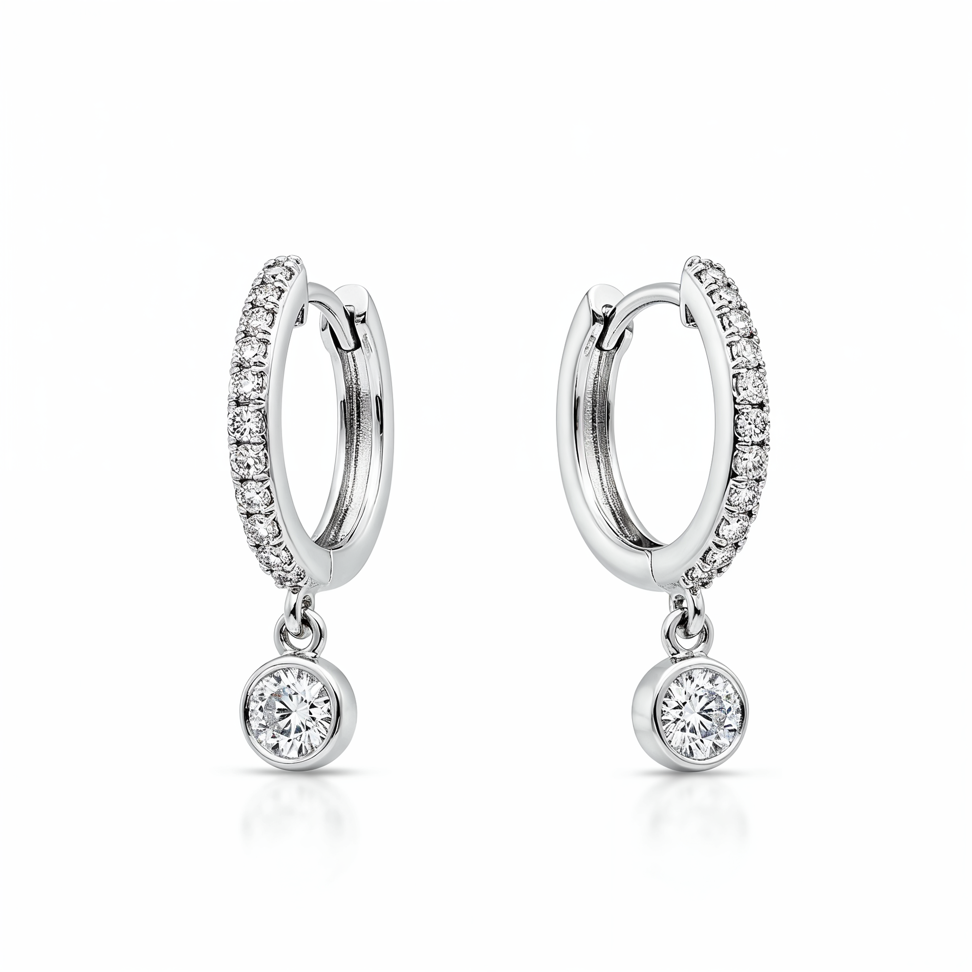 Pair of silver hoop earrings with small round gemstones on a white background