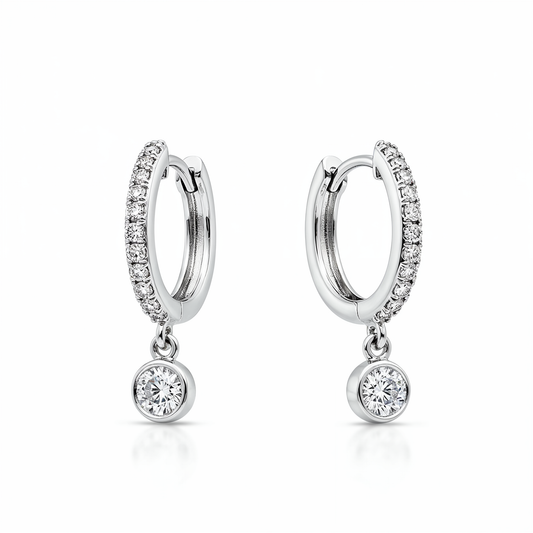Pair of silver hoop earrings with small round gemstones on a white background