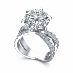 Diamond ring with a large central gemstone and smaller stones on a white background